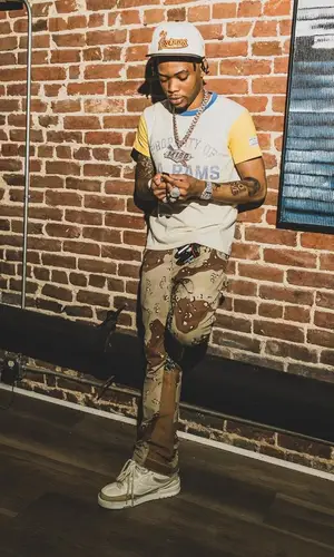 Lil Migo wearing Goyard bag