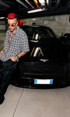 Sfera Ebbasta wearing Marine Serre shirt