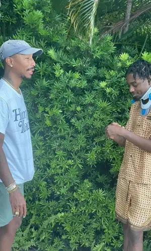 Lil Tjay wearing Amiri shirt