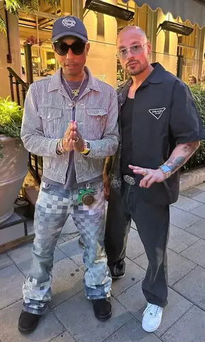Pharrell Williams’ Outfit in Levi’s Jacket, Louis Vuitton Eyewear & Human Made Cap (2023)