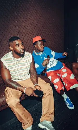 DaBaby wearing Mitchell & Ness jersey