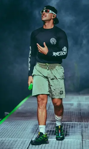 Feid’s Outfit in Chrome Hearts T-Shirt, Oakley Eyewear & Stone Island Swimwear (2023)