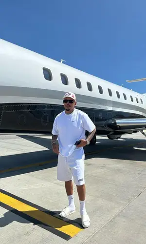 Luciano Loco wearing Live Fast Die Young sandal