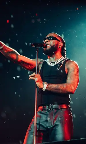 Burna Boy wearing Heliot Emil top