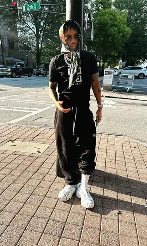 Tekno wearing Amiri pants