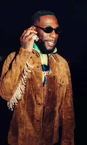 Burna Boy wearing Celine belt