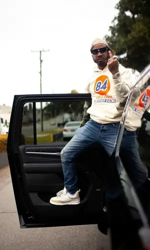 Benny The Butcher’s Outfit in Purple Brand Jeans & Louis Vuitton Cap (2023)