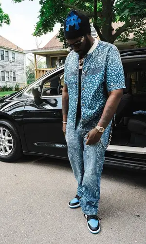 Peezy wearing Bottega Veneta belt