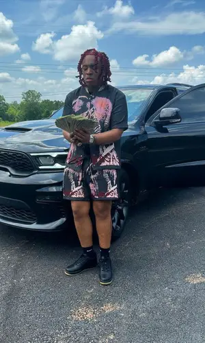 Lil Gotit’s Outfit in Valabasas Jacket & Nike Socks (2023)