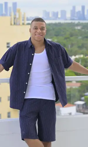 Kylian Mbappe wearing Dior shirt