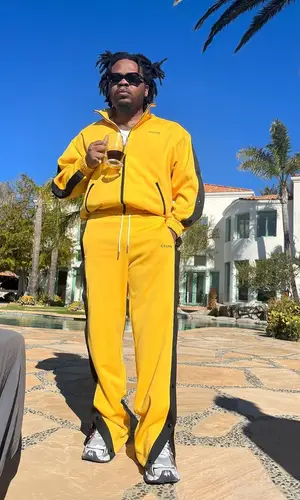 Olamide wearing Celine pants
