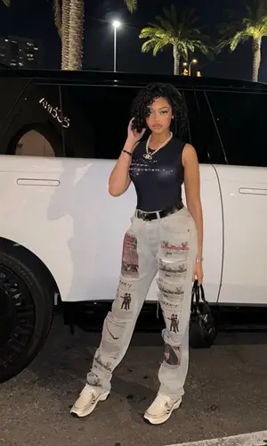 Jodie Woods wearing Chanel sneakers