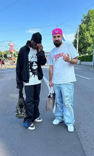 Travis Scott wearing Louis Vuitton bag