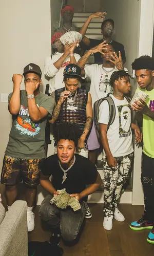 Lil Migo wearing Supreme sweater