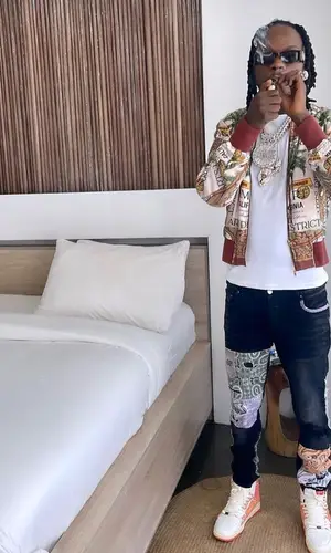 Naira Marley wearing Camilla eyewear