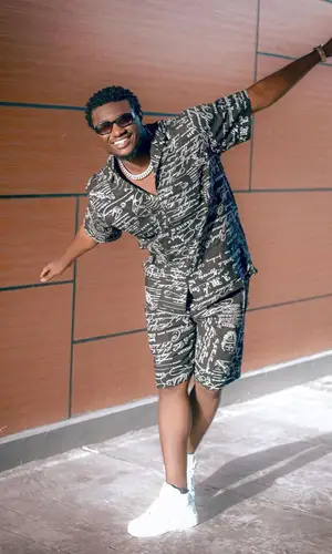 Abisi Emmanuel wearing Run Fashion suit