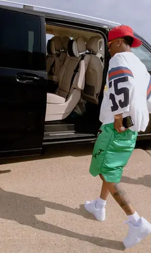 Wizkid’s Outfit in Kapital T-Shirt, Nike Sneakers & Bottega Veneta Eyewear (2023)