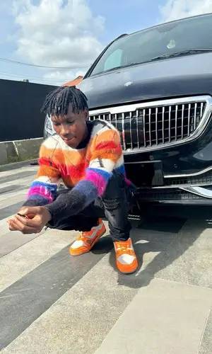 Zinoleesky wearing Louis Vuitton sneakers