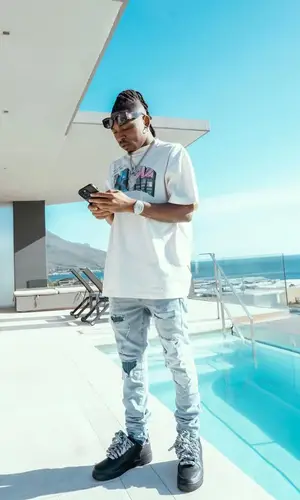 Mayorkun wearing Nike sneakers