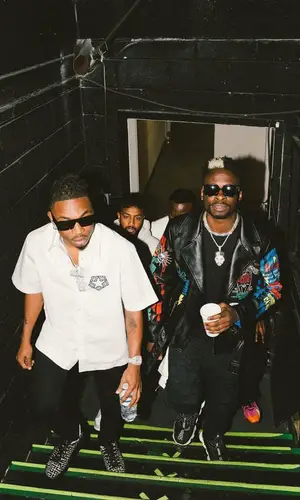 Mayorkun wearing Givenchy shirt