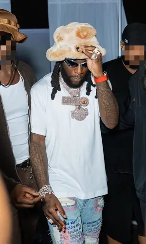 Burna Boy wearing Gallery Dept. hat