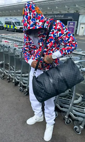 Fivio Foreign wearing Louis Vuitton bag
