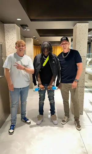 Russ Millions wearing Amiri t-shirt