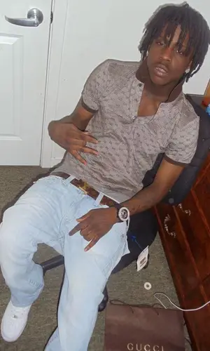 Chief Keef wearing Louis Vuitton belt