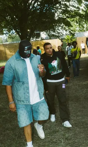 M Huncho wearing Louis Vuitton sneakers