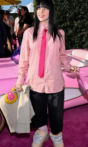 Billie Eilish’s Outfit in Raf Simons Jacket, Gucci Shirt & Vivienne Westwood Bag (2023)