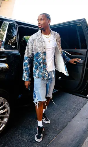 Shai wearing Greg Lauren shirt
