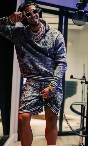 Anuel AA wearing Amiri hoody
