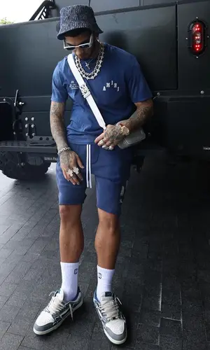 Anuel AA’s Outfit in Amiri T-Shirt & Prada Eyewear (2023)