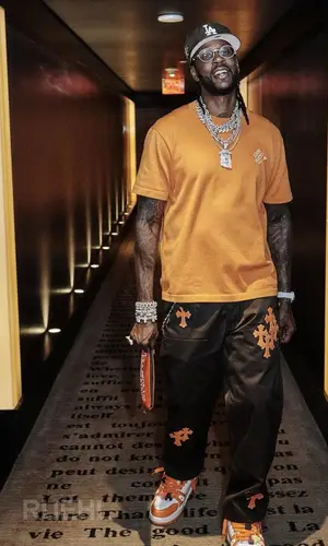 2 Chainz’s Outfit in Louis Vuitton T-Shirt, Chrome Hearts Pants & Cartier Eyewear (2023)