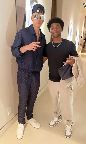 Tyler Herro’s Outfit in Saint Laurent Sneakers & Giorgio Armani Cap (2023)