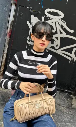 Minnie wearing Miu Miu bag