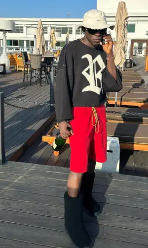 Spinall wearing Rick Owens boots