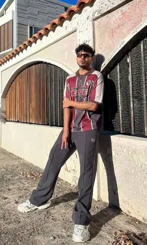 Álvaro Díaz wearing Needles pants