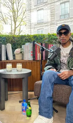 Pharrell Williams’ Outfit in Planet Of The Apes T-Shirt, Louis Vuitton Eyewear & Human Made Cap (2023)