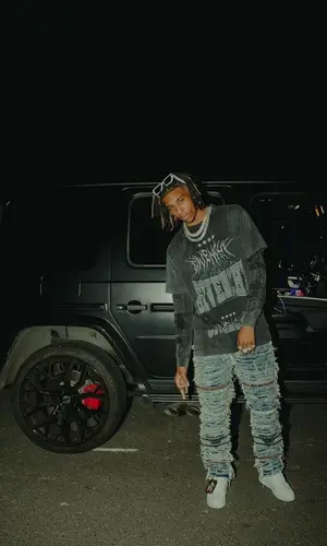 Michael Olise wearing Louis Vuitton sneakers