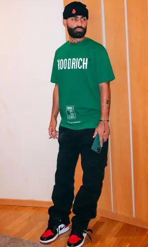 Arcangel wearing Off-White pants