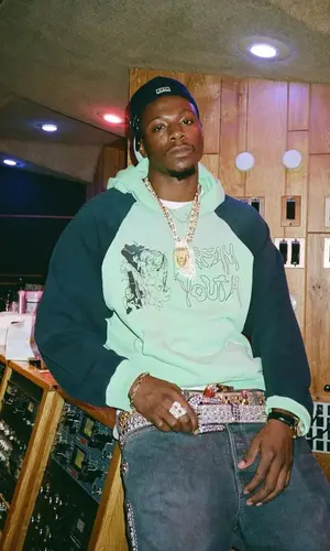 Joey Badass’ Outfit in Liberal Youth Ministry Hoodie, Kapital Jeans & B.B. Simon Belt (2023)