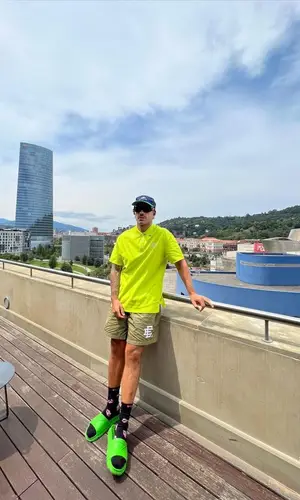 Feid’s Outfit in Louis Vuitton Shirt, Oakley Eyewear & Chrome Hearts Socks (2023)
