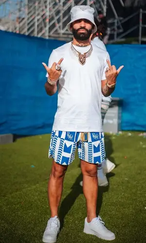 Arcangel’s Outfit in Nike Sneakers, Prada Hat & Rhude Swimwear (2023)