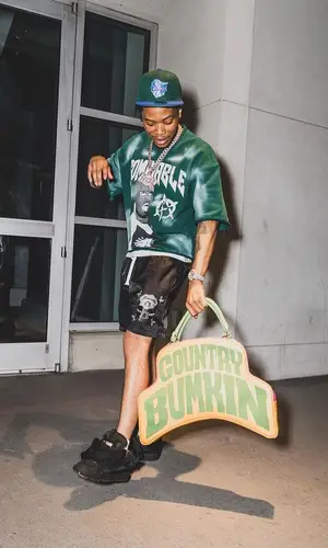 Lil Migo wearing Country Bumkin bag