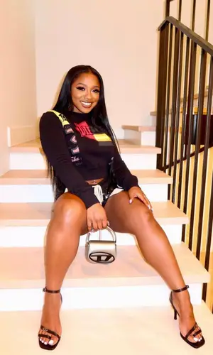 Reginae Carter wearing Diesel sweatshirt
