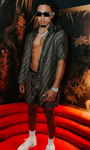 Myke Towers wearing Fendi swimwear