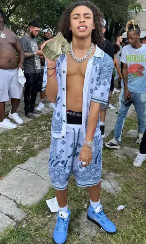 DD Osama wearing Amiri shirt