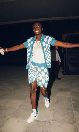 Bobby Shmurda wearing Rhude shirt
