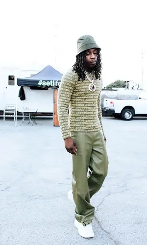 Polo G wearing Prada hat